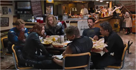 A scene from the same movie showing a group of people hanging out at a restaurant table