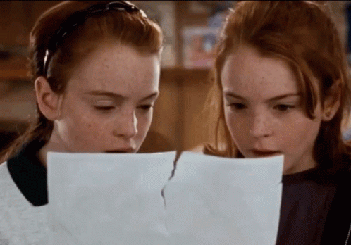 A GIF from the movie Parent Trap, when the twins put two pieces of a photograph together